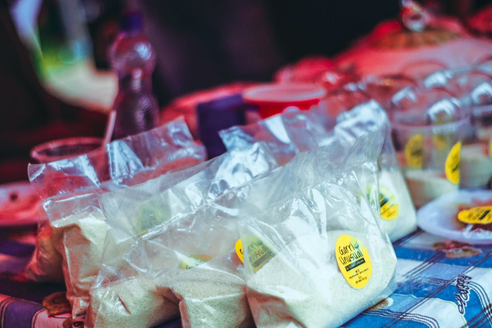 bags of white garri for sale at a market